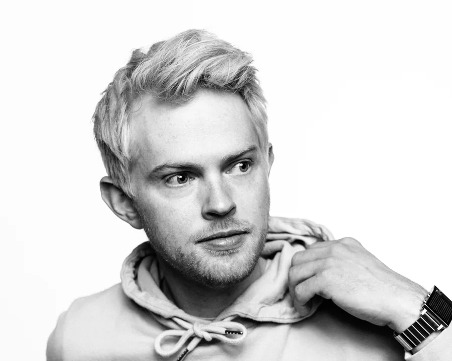 A black-and-white studio portrait of Cory Vetter.