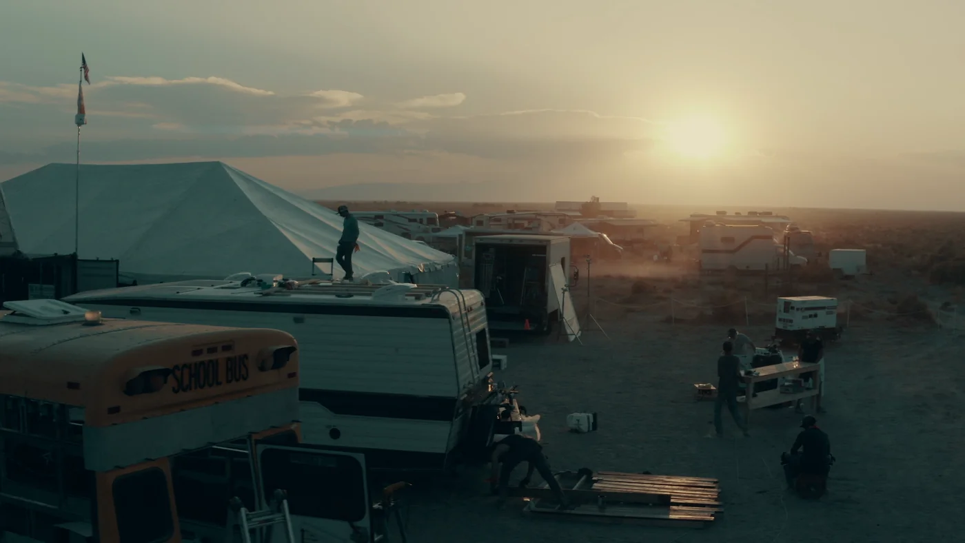 The Gutted season one worksite and vehicles at sunset.